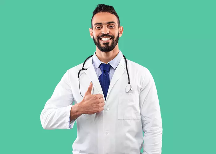 Man in a lab coat doing a thumbs-up