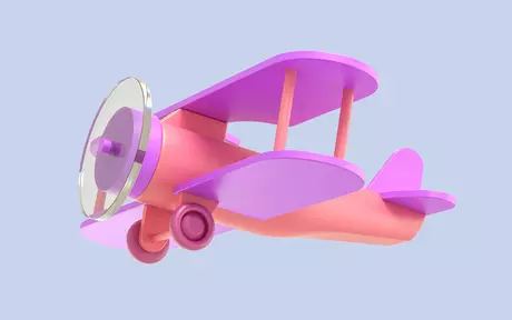 Buntes Spielzeugflugzeug auf einem lilafarbenen Hintergrund