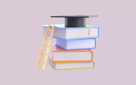 Doktorhut auf einem Stapel Bücher